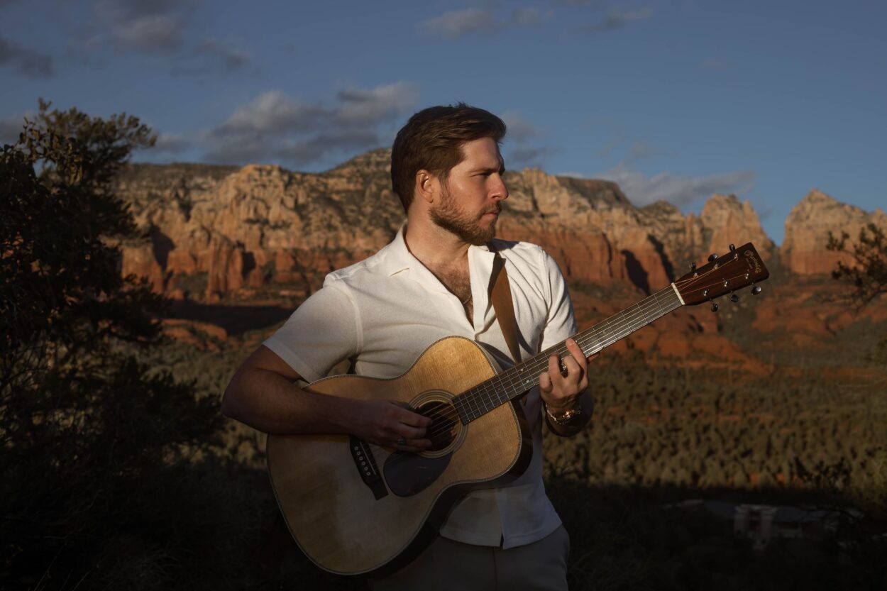 man playing guitar in red rock state park