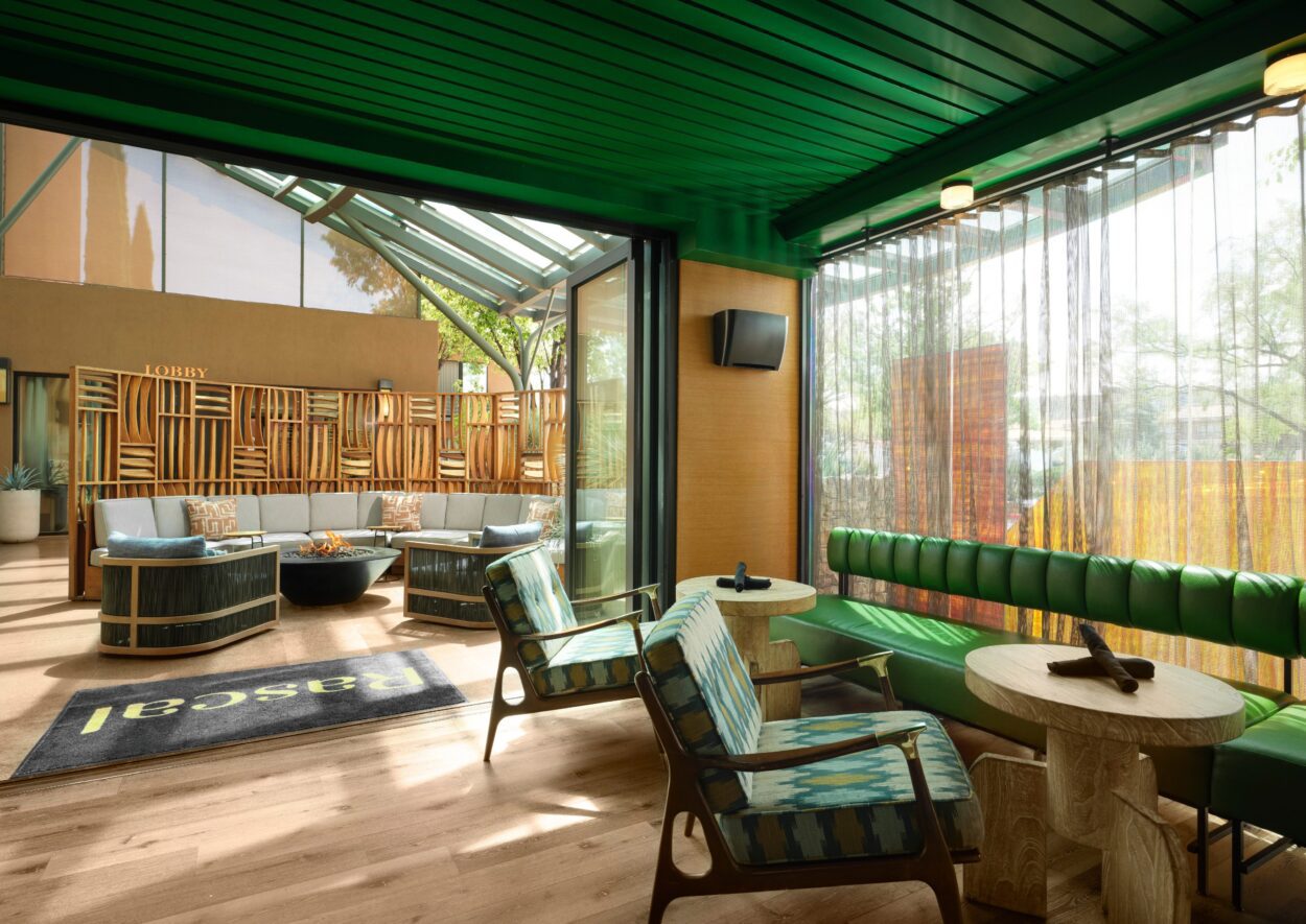 Sedona Wilde restaurant lobby fireplace decorated in green designs