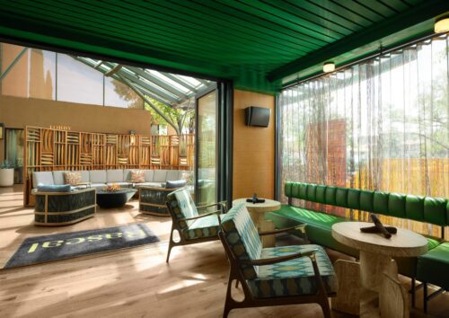 Sedona Wilde restaurant lobby fireplace decorated in green designs