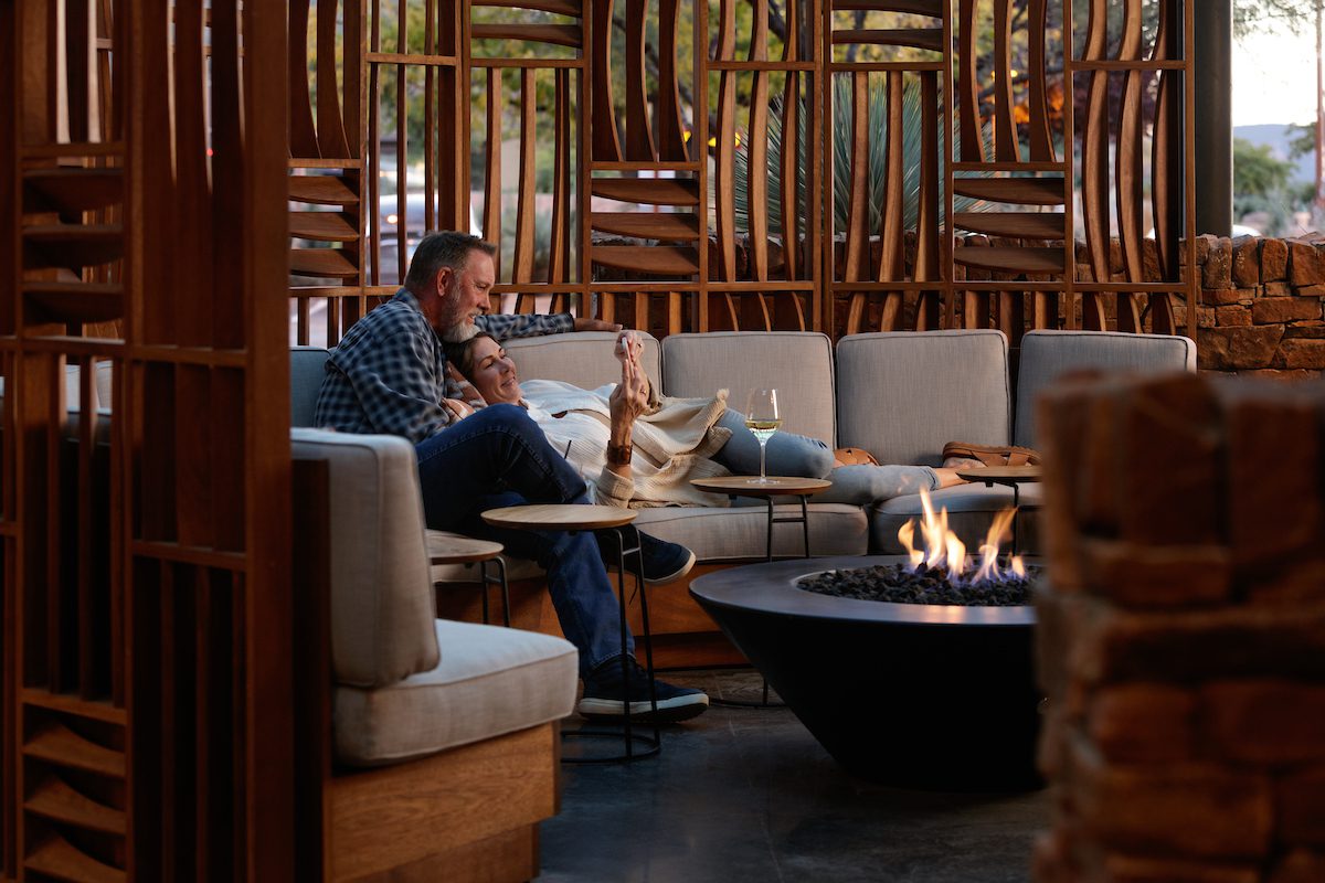 Couple lounging at fire pits