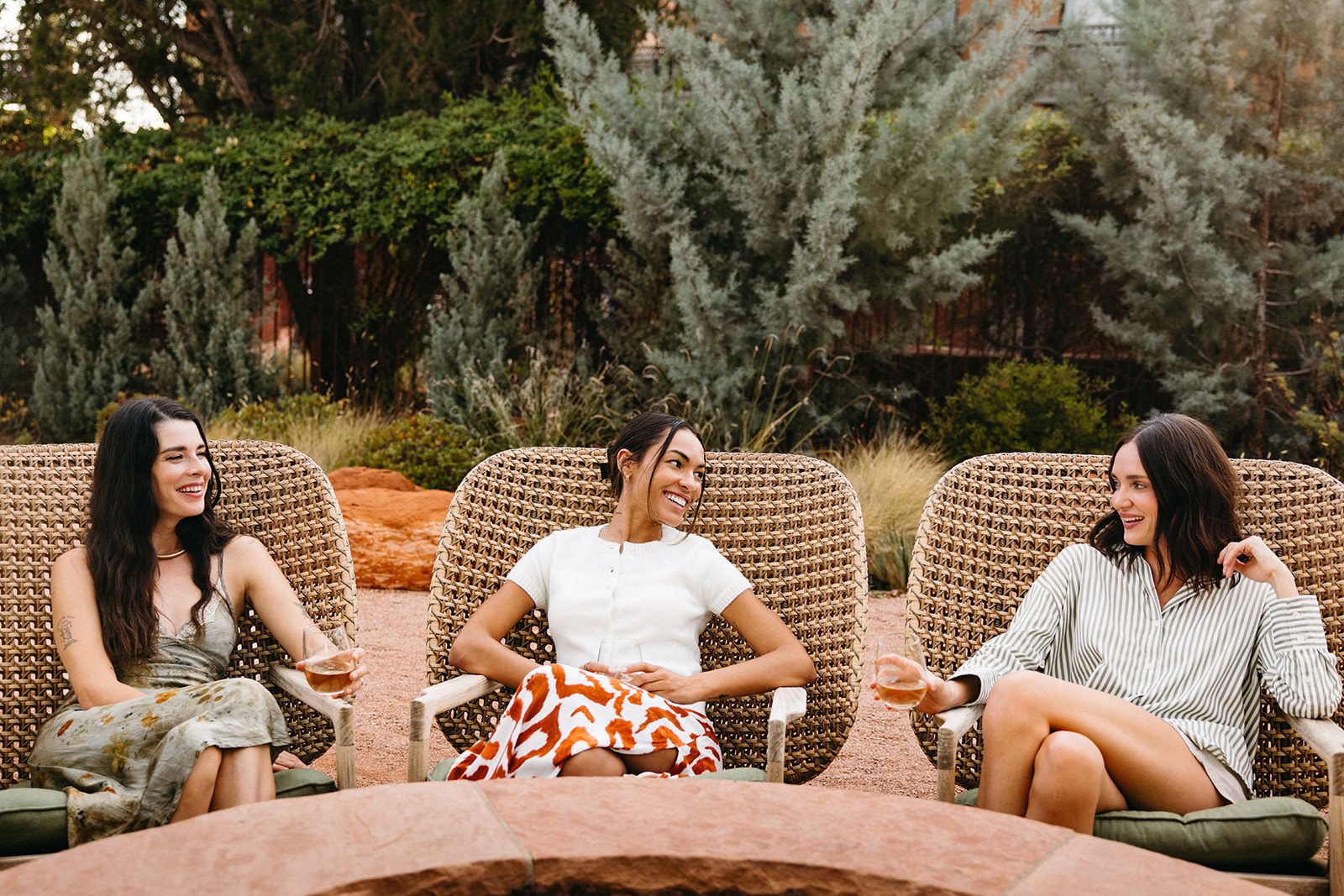 Women sitting around fire pits at the Wilde Resort and Spa
