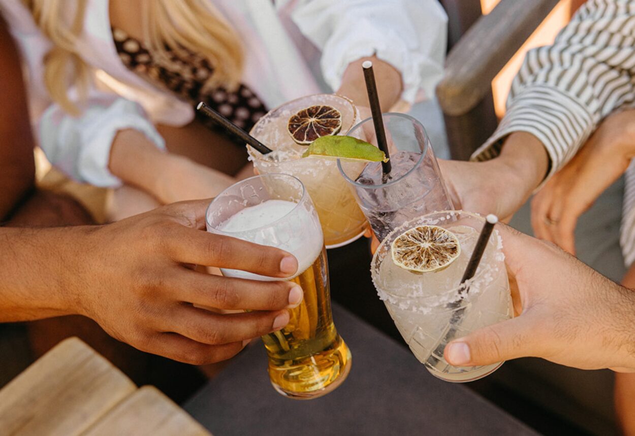 Friends with drinks at the Wilde Pool Bar