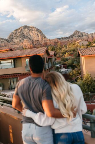 Couple facing away from camera, outdoors